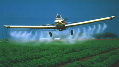 airplane crop dusting field